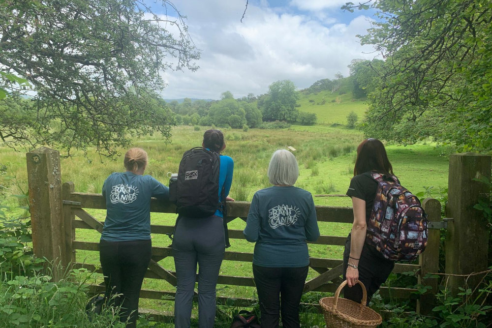 People foraging and view of Cambrian Mountains in Ceredigion, Mid Wales