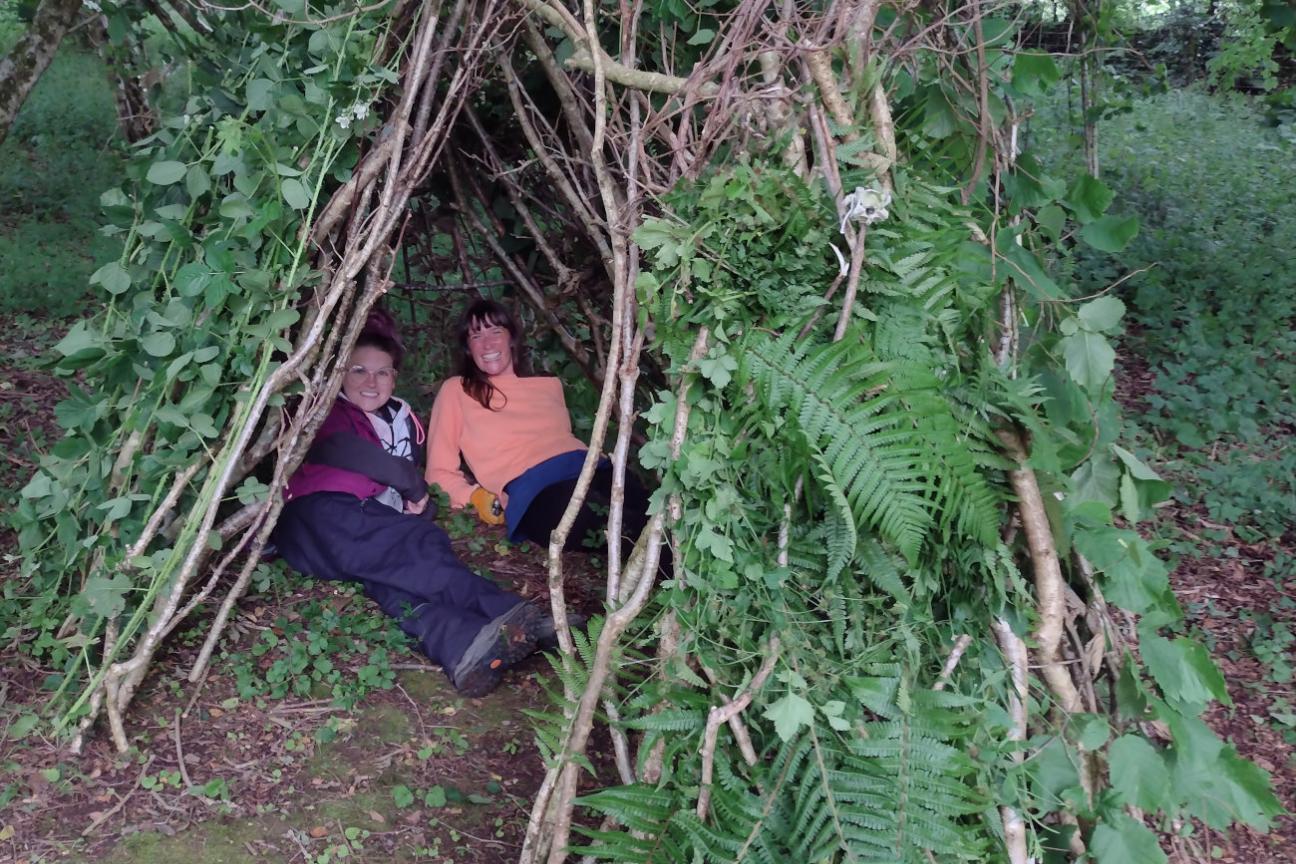 Bushcraft people making a shelter in nature.